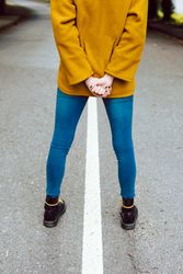 Anonymous woman standing on road