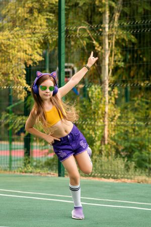 Schoolgirl playing on sports ground