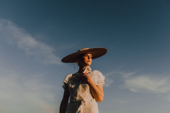 woman in hats in bright sunny day