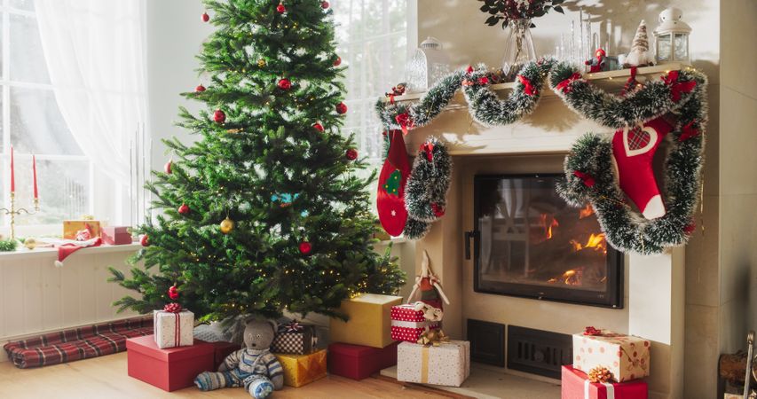 Empty Shot of Decorated Corner in Modern House with Christmas Tree, Fireplace and Gifts.