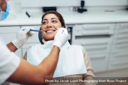 Woman getting a dental treatment at dentist office 0VPDj4