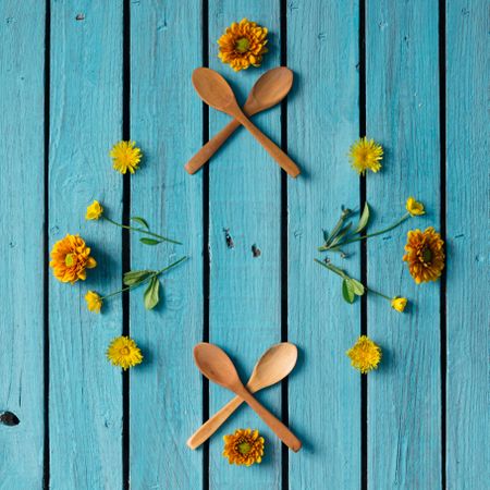 Orange and yellow floral pattern arranged on blue background