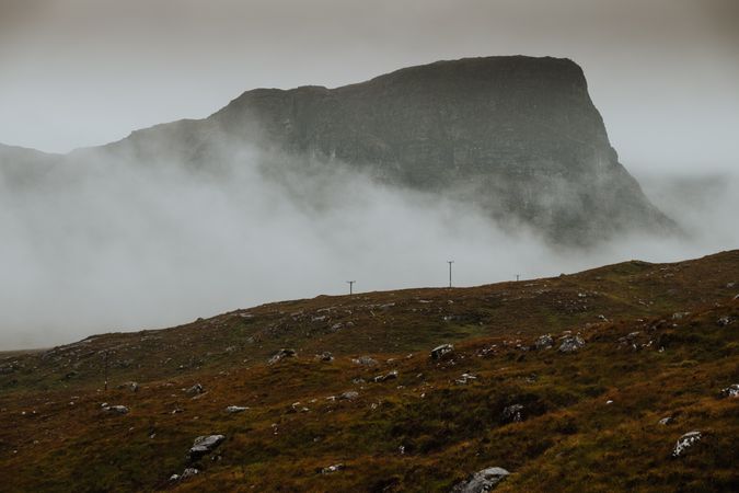 Rocky hills covered by mist in Scotland