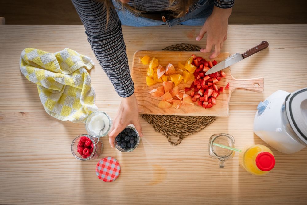 Crop woman preparing healthy food