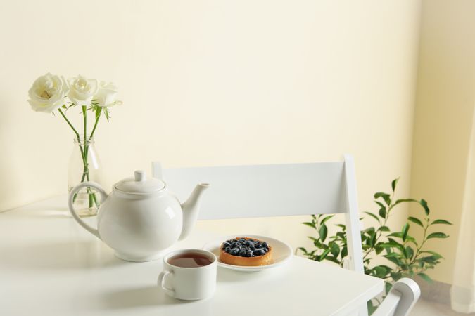 Concept of breakfast with blueberry pie on table