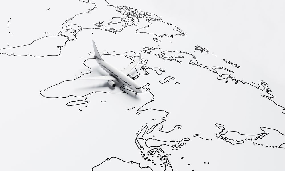 Airplane model going over drawn map