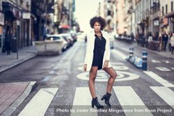 Female in short dress, heels and blazer posing on street with cars 5o8My4