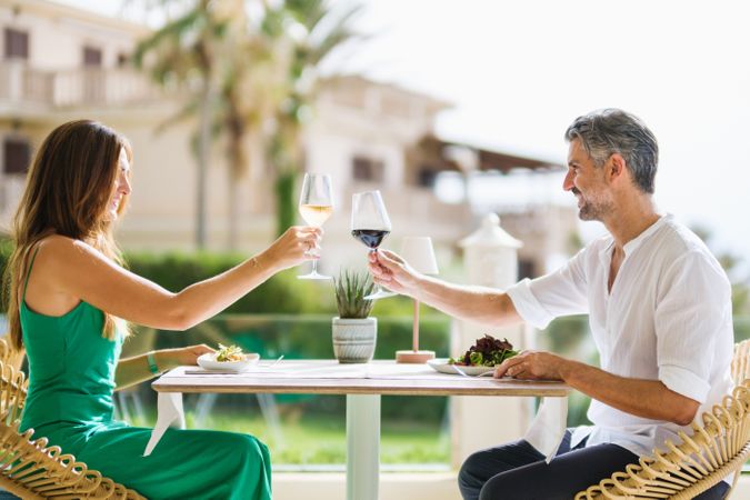 Couple proposing toast in restaurant