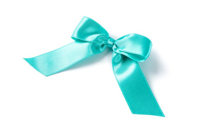 Turquoise bow isolated on plain background. Gift concept