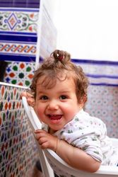 Baby having fun on chair