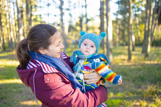 Portrait of a mother and her child during a sunny autumn day.