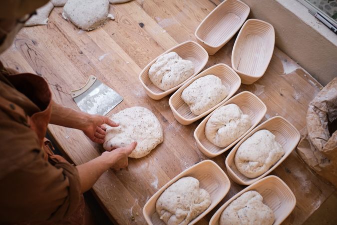Leavened bread dough in the moulds resting to be baked.