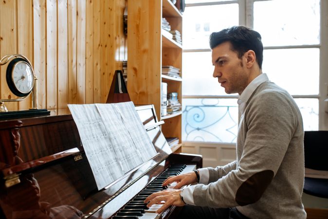 Man playing piano in studio
