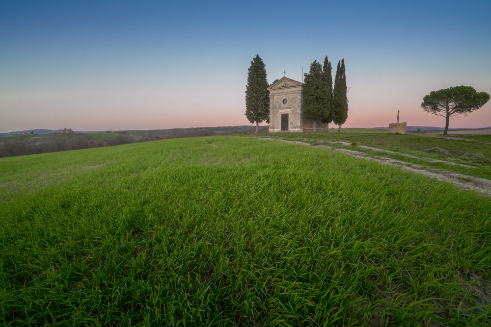 Single chapel among trees on field