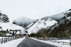 Asphalt lane in mountain landscape in winter