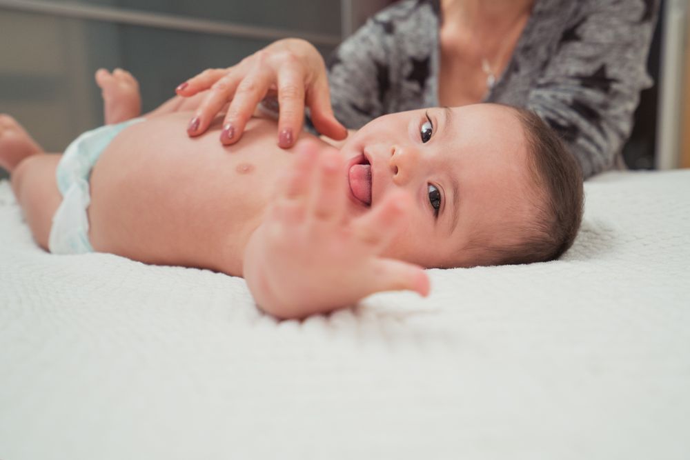 Portrait of cute baby boy with Down syndrome