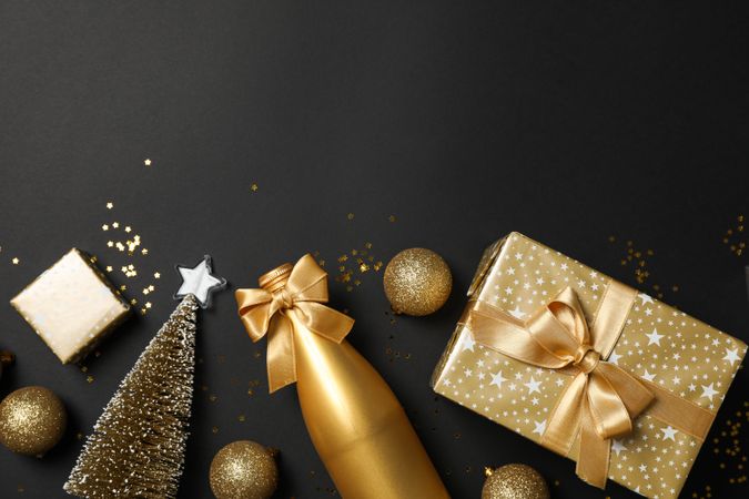 Composition with presents and christmas accessories on dark background, copy space