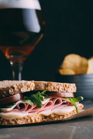 Delicious sandwich with ham, cheese, lettuce and tomato