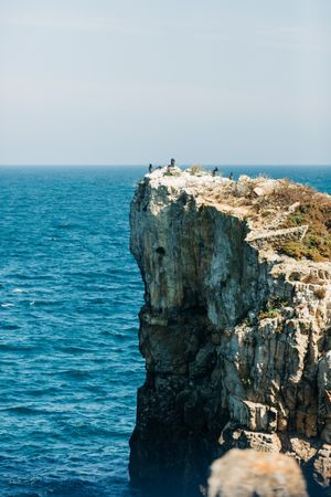 Rough cliff in blue sea