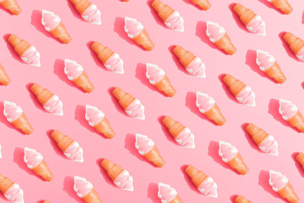 Ice cream in cones on pink background