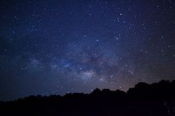 Milky way galaxy with stars and space dust in the universe at PhuHinRongkla Ntional Park
