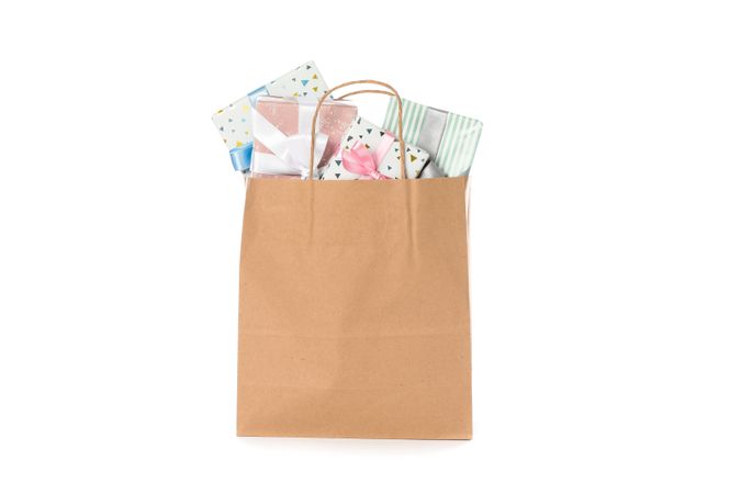 Paper bag with presents isolated on blank background