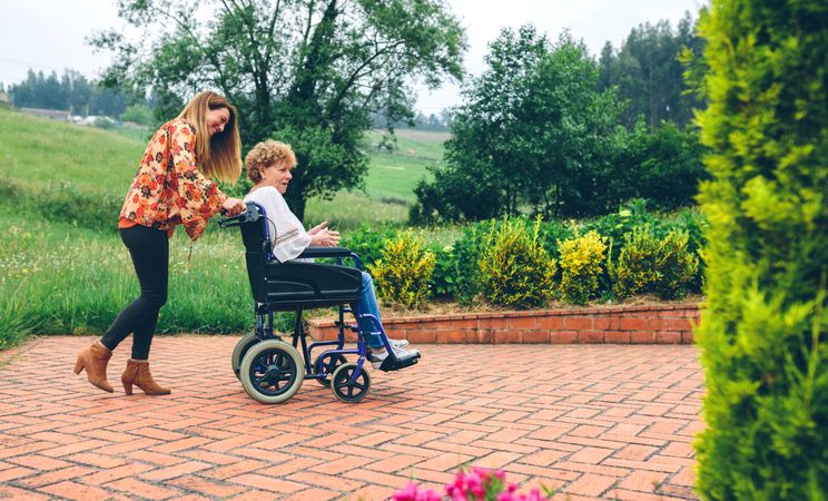 Woman with her mother in a wheelchair