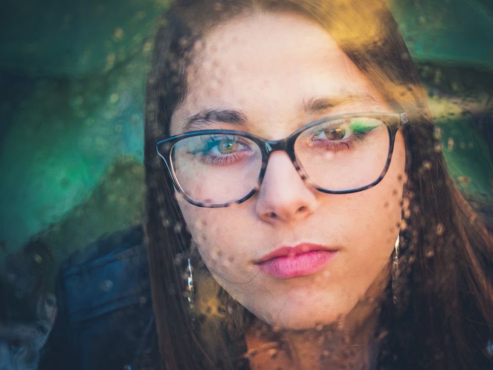 Woman in eyeglasses and earrings
