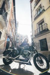 Young woman in custom motorbike