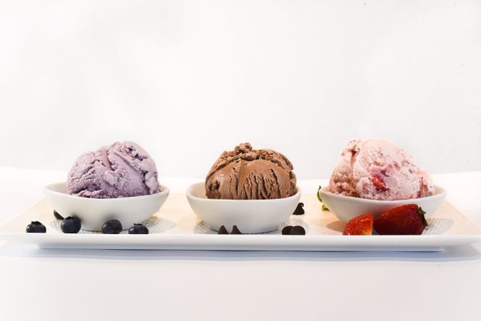 Side view of three different ice cream scoops
