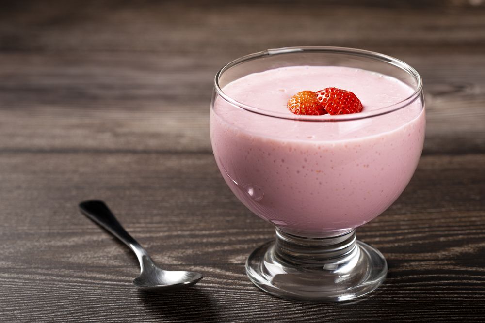 Delicious strawberry mousse in glass goblet.