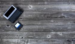 Vintage technology on old wooden desk table