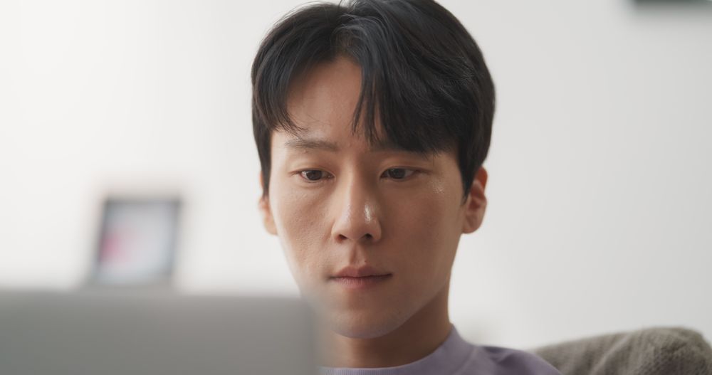 Portrait of a South Korean Male Focused on Virtual Work from Home