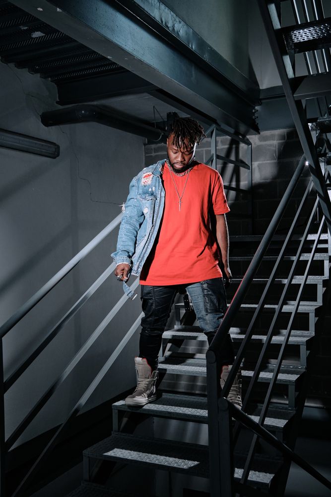 Black male standing on steps
