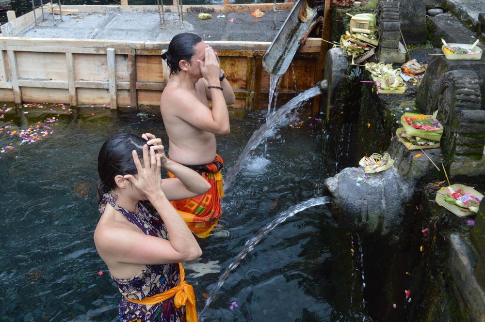 Man and woman taking a bathing in fountain