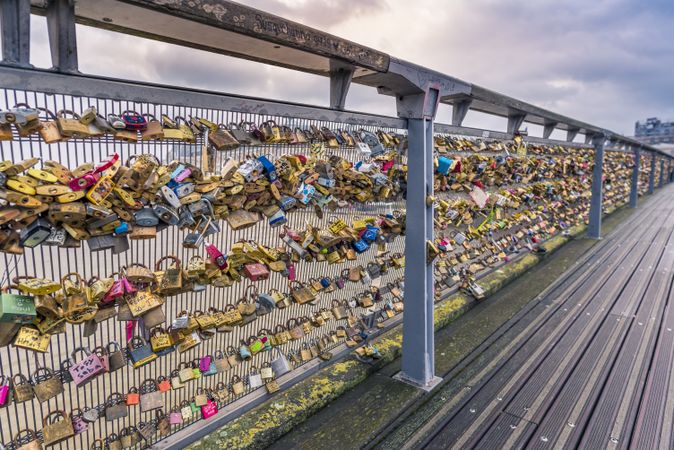 Myriad of locks on an iron balustrade of a bridge
