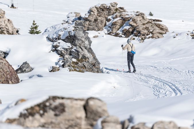 Anonymous skiing in mountainous terrain in winter
