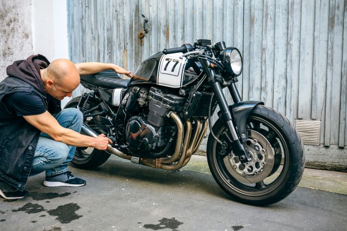 Biker checking with a motorcycle