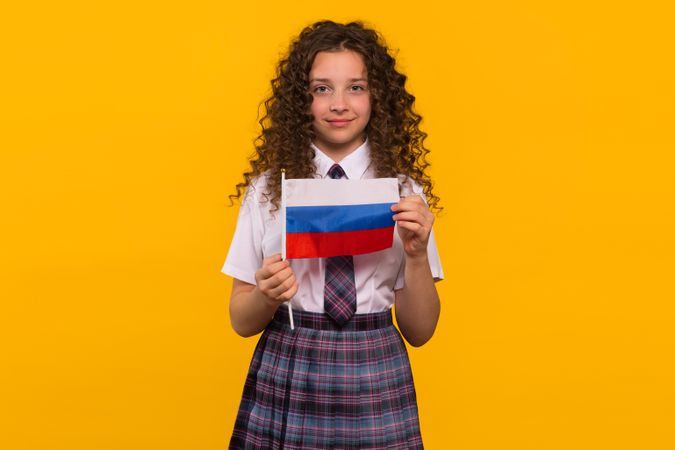 Girl holding Russian flag