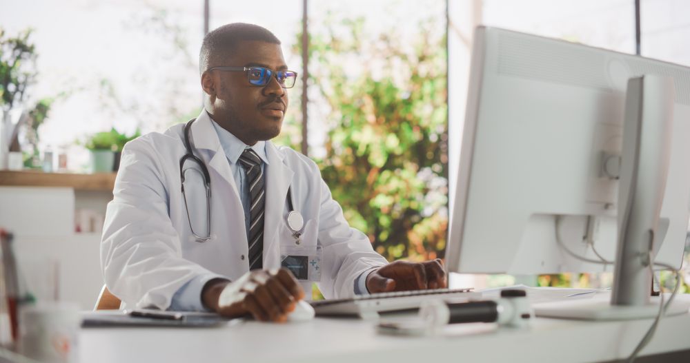 Black Medical Health Care Professional Working with Test Results, Patient Treatment Planning