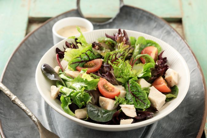 Healthy Salad Bowl with  Different  Lettuce, Red Spinach, Cubed Boiled Chicken, Tomato