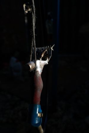Sheep shearing machine hanging on rope