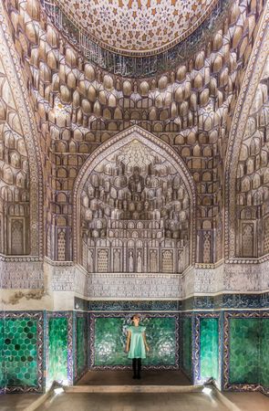 Unrecognizable tourist inside ancient building