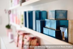 Boxes of beauty products on a shelf 0Je88b
