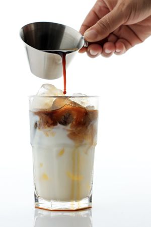 Pour Espresso to a Glass of Milk, Process Making Iced Coffee Espresso