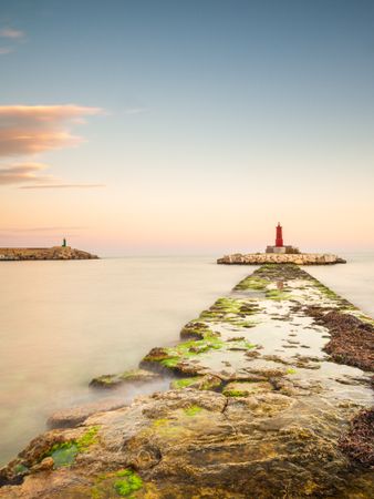 Rough path to islet with lighthouse