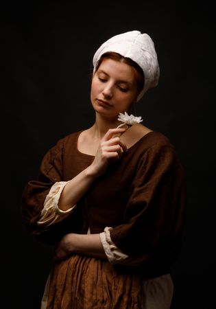 Medieval maid holding flower