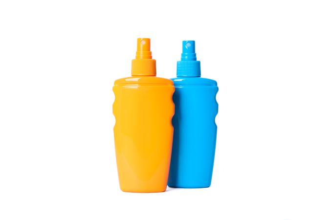 Sunscreen sprays isolated on blank background. Summer vacation accessories