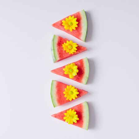 Watermelon slices with yellow flowers
