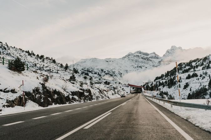 Countryside road between snow hills
